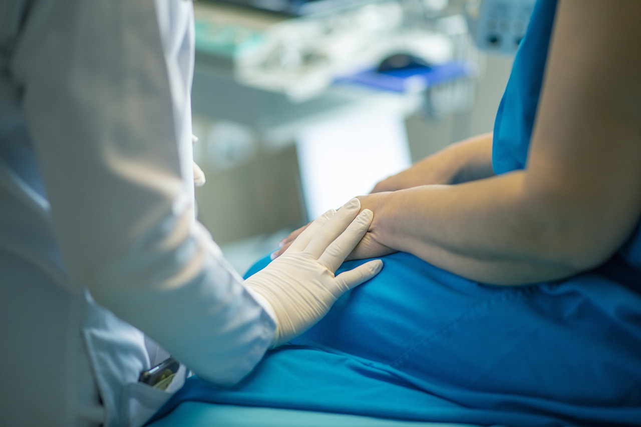 A doctor and patient in a health facility.