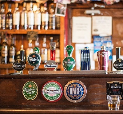 A bar or pub with beers on tap.