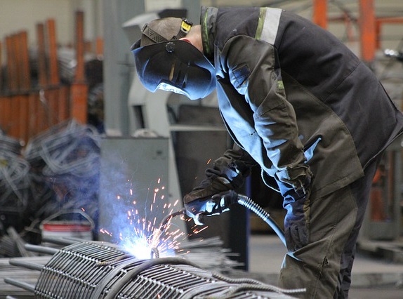 Machine operator working on welding project